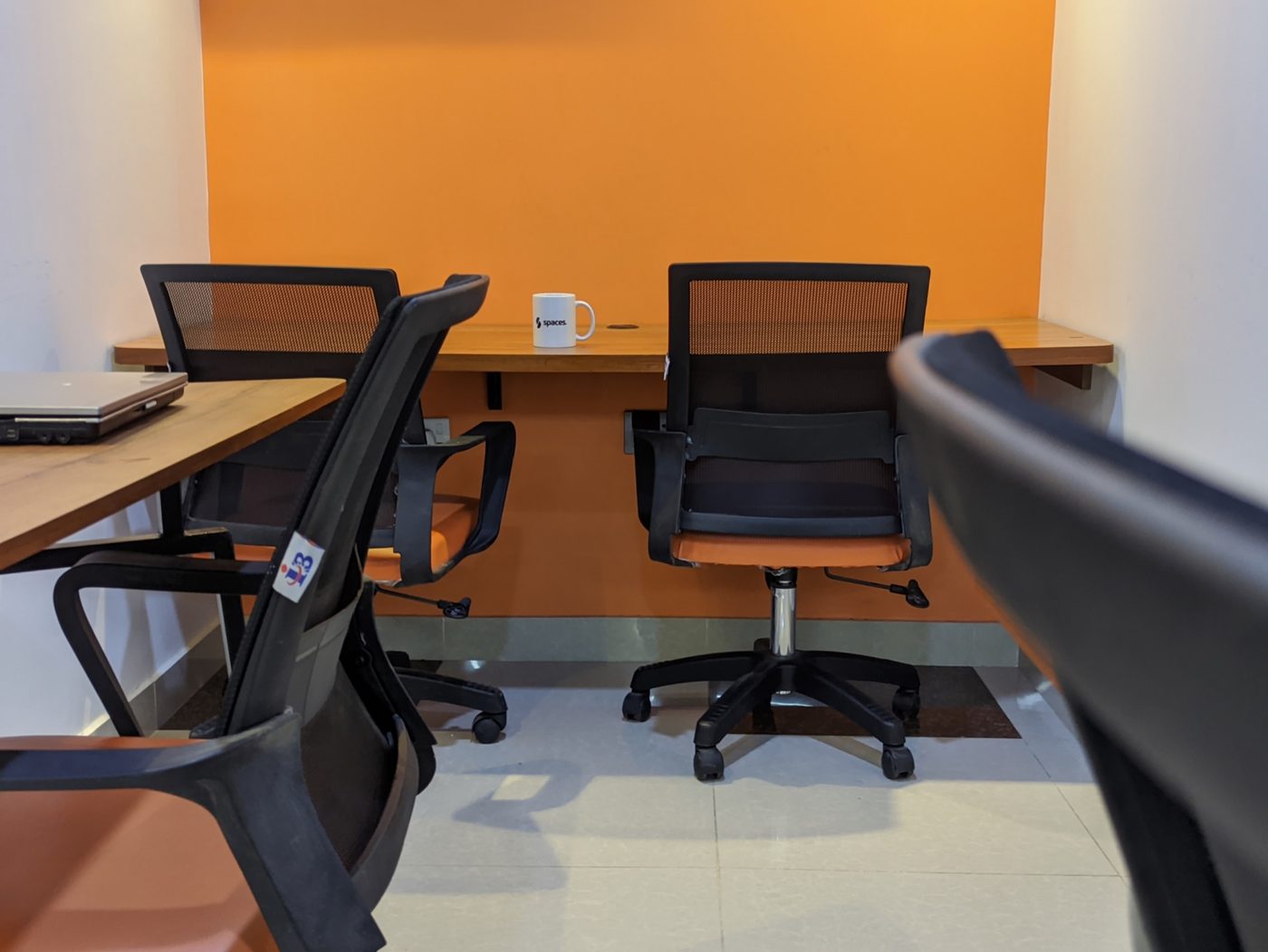 Warm four-person workspace at Spaces