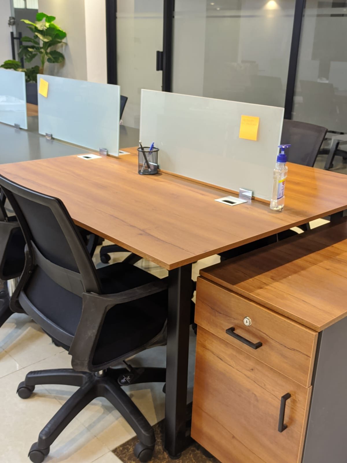 A reserved desk with its own mobile storage locker at Spaces